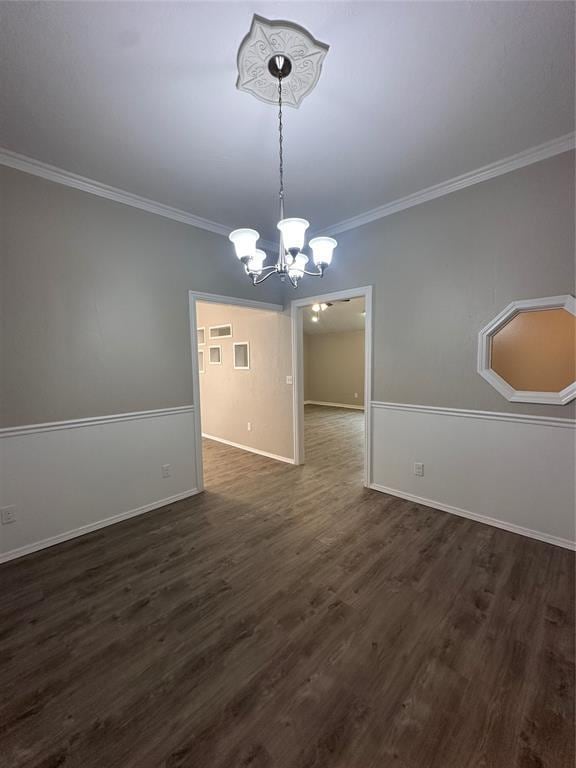 8317 NW 85th St, Oklahoma City, OK 73132 - unfurnished dining area with a chandelier, ornamental molding, and dark wood-type flooring
