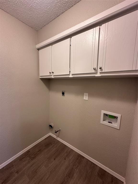 8317 NW 85th St, Oklahoma City, OK 73132 - laundry room featuring dark wood finished floors, hookup for a washing machine, electric dryer hookup, gas dryer hookup, and cabinet space