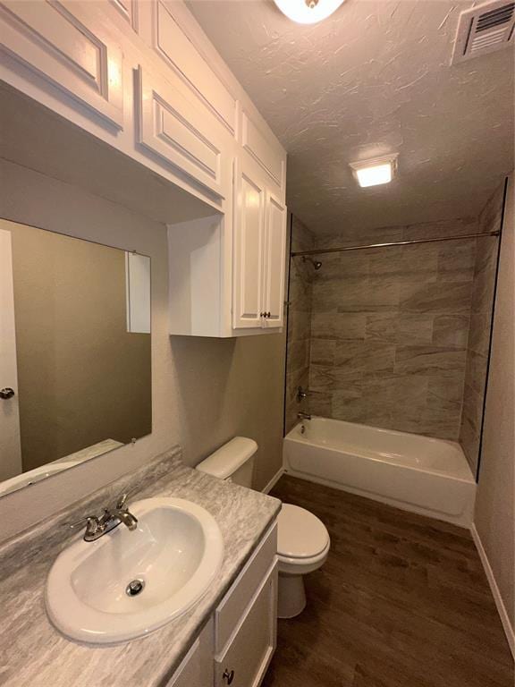 8317 NW 85th St, Oklahoma City, OK 73132 - full bathroom featuring vanity, wood finished floors, and shower / tub combination