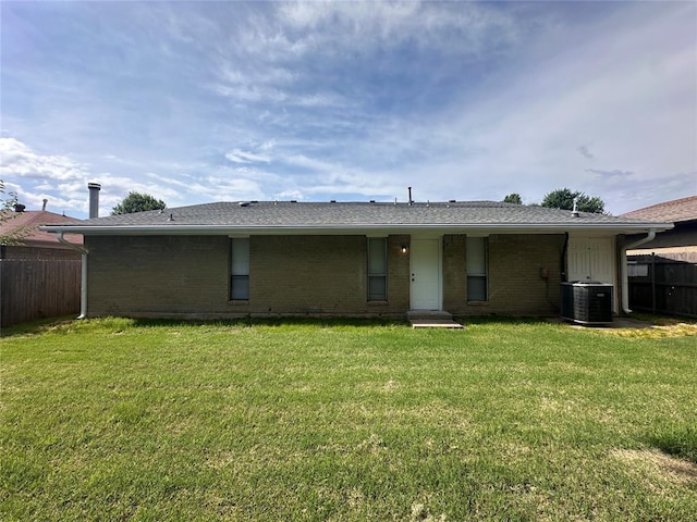 8317 NW 85th St, Oklahoma City, OK 73132 - rear view of property with brick siding and roof with shingles