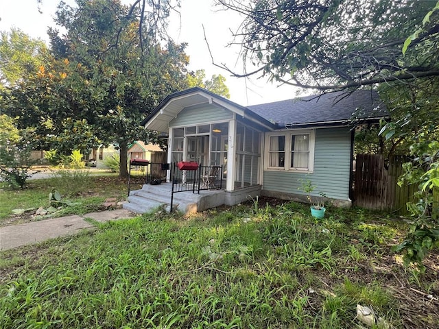 316 N University Blvd, Norman, OK 73069 - view of front of property featuring a sunroom and a shingled roof