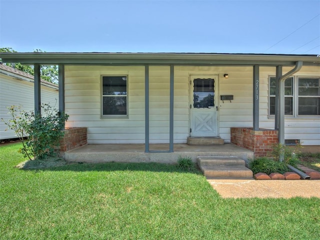 2713 S Glenn Ave, Del City, OK 73115 - property entrance featuring a lawn and a porch