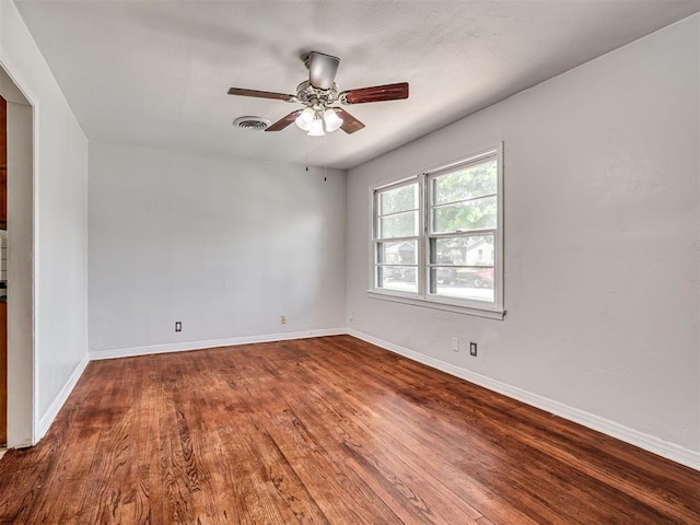 2713 S Glenn Ave, Del City, OK 73115 - unfurnished room with wood finished floors and a ceiling fan
