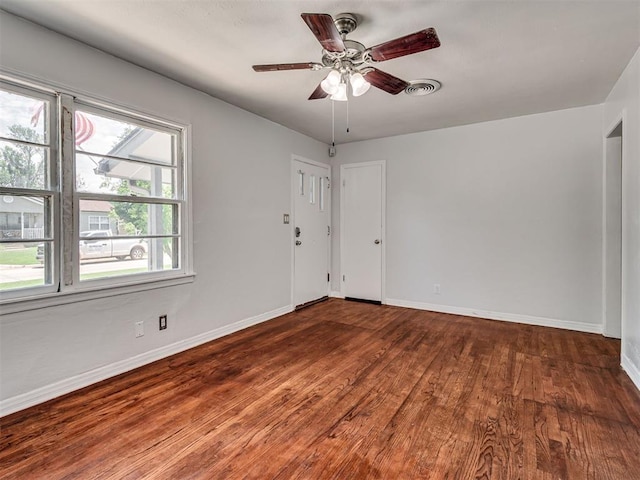 2713 S Glenn Ave, Del City, OK 73115 - unfurnished room with wood finished floors and a ceiling fan