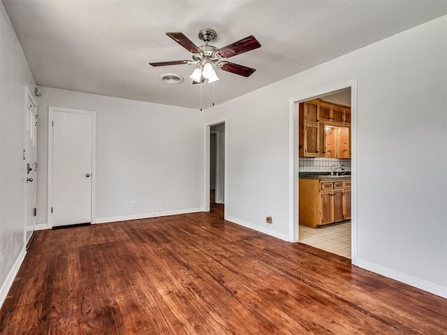 2713 S Glenn Ave, Del City, OK 73115 - empty room featuring wood finished floors and a ceiling fan