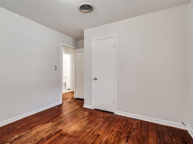 2713 S Glenn Ave, Del City, OK 73115 - spare room featuring hardwood / wood-style flooring and baseboards