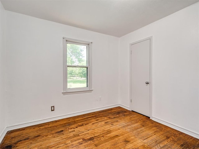 2713 S Glenn Ave, Del City, OK 73115 - empty room with hardwood / wood-style floors and baseboards