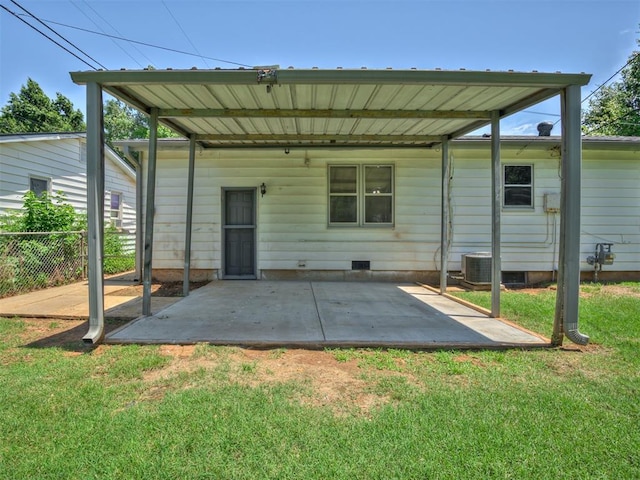 2713 S Glenn Ave, Del City, OK 73115 - rear view of house featuring a patio area, a carport, and crawl space