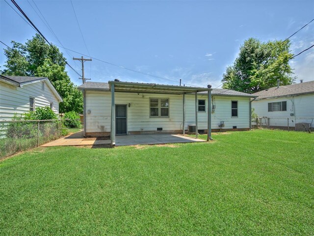 2713 S Glenn Ave, Del City, OK 73115 - rear view of house featuring a patio, a fenced backyard, and crawl space