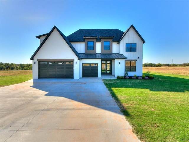 2741 Two Socks Run, Guthrie, OK 73044 - modern farmhouse style home featuring concrete driveway, a front lawn, a standing seam roof, a metal roof, and board and batten siding