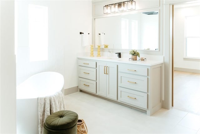 2741 Two Socks Run, Guthrie, OK 73044 - bathroom with vanity and a soaking tub