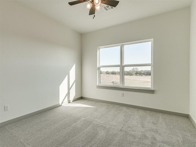 2741 Two Socks Run, Guthrie, OK 73044 - spare room with carpet flooring and ceiling fan