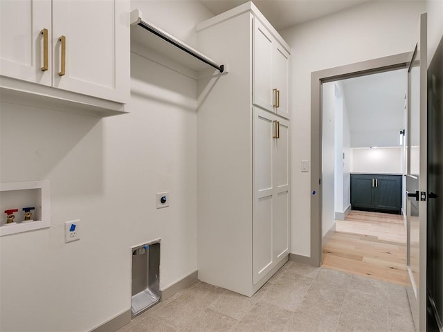2741 Two Socks Run, Guthrie, OK 73044 - laundry area featuring cabinet space, washer hookup, hookup for an electric dryer, and light tile patterned floors