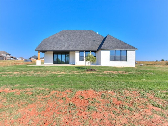 2741 Two Socks Run, Guthrie, OK 73044 - back of house with a lawn and a shingled roof