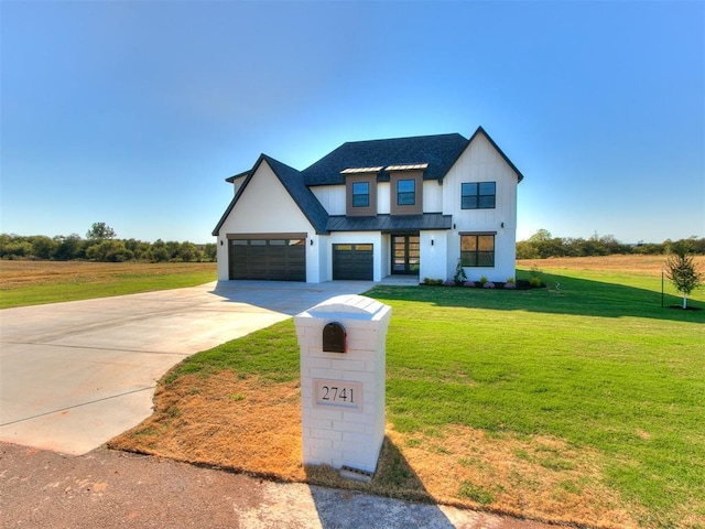 2741 Two Socks Run, Guthrie, OK 73044 - modern farmhouse style home featuring concrete driveway, a front yard, a standing seam roof, a metal roof, and board and batten siding