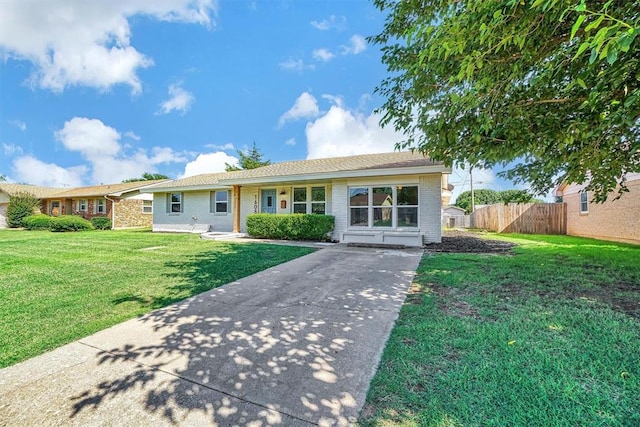 1608 Truman Dr, Altus, OK 73521 - ranch-style house featuring concrete driveway and brick siding