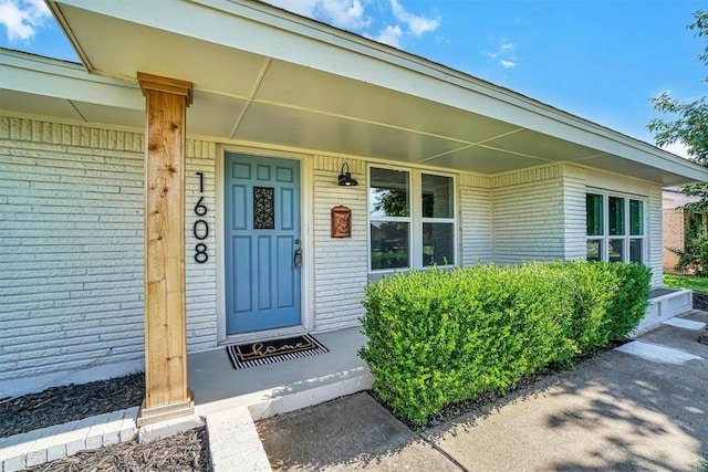 1608 Truman Dr, Altus, OK 73521 - view of exterior entry with brick siding and covered porch