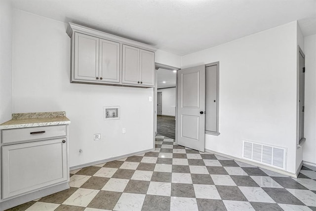 1608 Truman Dr, Altus, OK 73521 - washroom featuring washer hookup and cabinet space