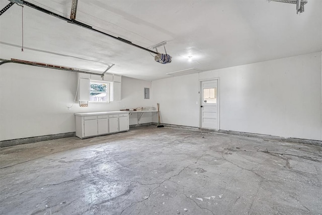 1608 Truman Dr, Altus, OK 73521 - garage featuring a garage door opener and electric panel