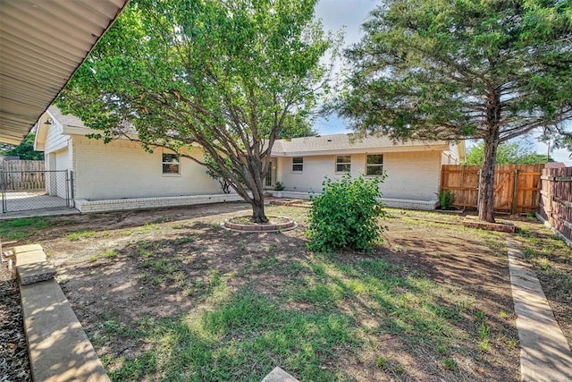 1608 Truman Dr, Altus, OK 73521 - view of yard featuring a garage
