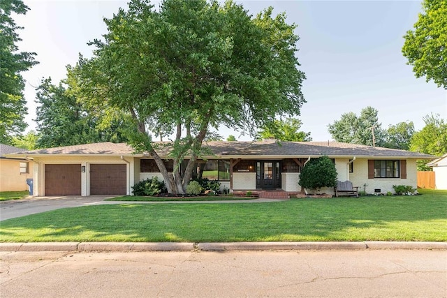 1503 Brighton Ave, Oklahoma City, OK 73120 - ranch-style house featuring an attached garage, a front lawn, concrete driveway, and brick siding