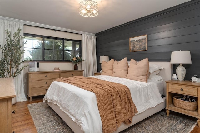 1503 Brighton Ave, Oklahoma City, OK 73120 - bedroom with wood finished floors and ornamental molding