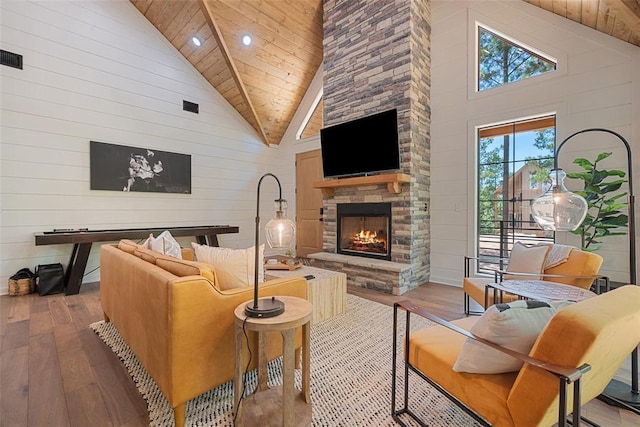 42 Hickory Ridge Rd, Broken Bow, OK 74728 - living room featuring hardwood / wood-style floors, high vaulted ceiling, wooden walls, a fireplace, and wood ceiling