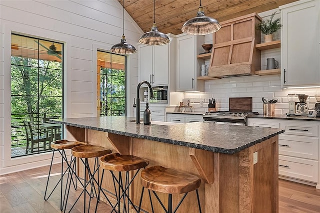 42 Hickory Ridge Rd, Broken Bow, OK 74728 - kitchen featuring open shelves, vaulted ceiling, wooden ceiling, stove, and decorative backsplash