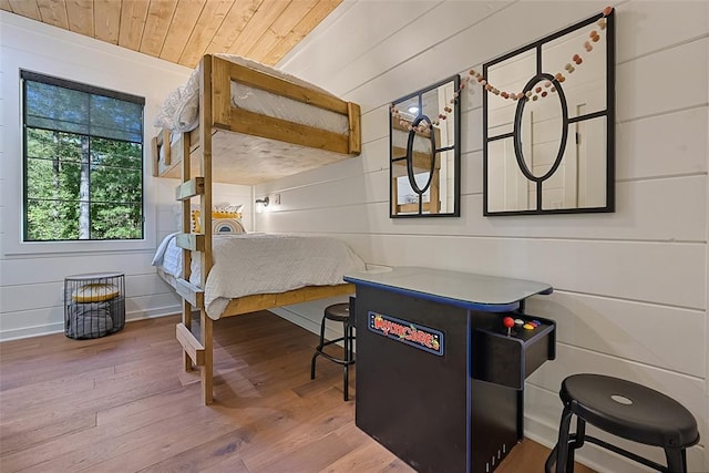 42 Hickory Ridge Rd, Broken Bow, OK 74728 - playroom featuring wood finished floors, wood ceiling, and wood walls