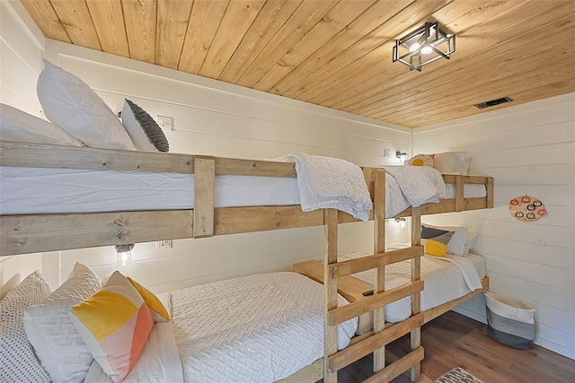 42 Hickory Ridge Rd, Broken Bow, OK 74728 - bedroom with wood ceiling, wood finished floors, and wood walls