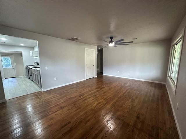 112 Burk Way, Del City, OK 73115 - unfurnished room featuring wood finished floors and a ceiling fan