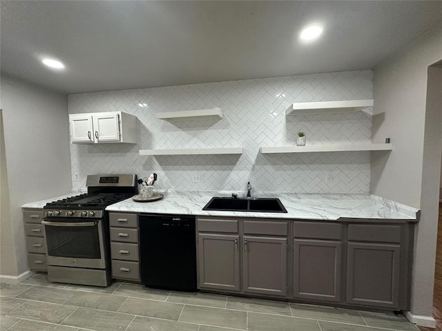 112 Burk Way, Del City, OK 73115 - kitchen with black dishwasher, gas stove, open shelves, decorative backsplash, and light stone counters
