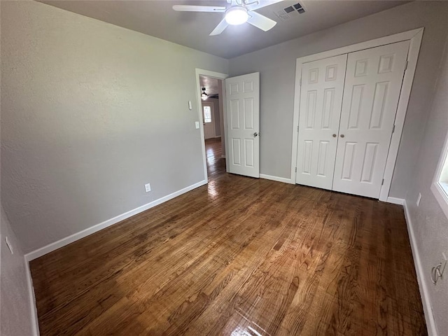 112 Burk Way, Del City, OK 73115 - unfurnished bedroom with wood finished floors, a closet, and ceiling fan