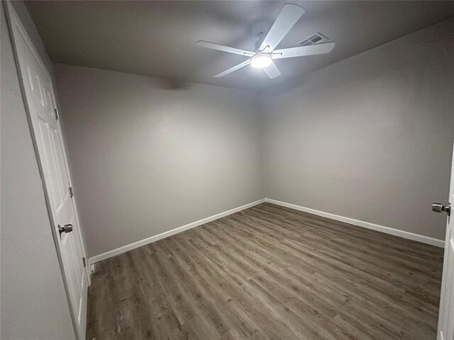 112 Burk Way, Del City, OK 73115 - unfurnished room featuring ceiling fan and dark wood finished floors