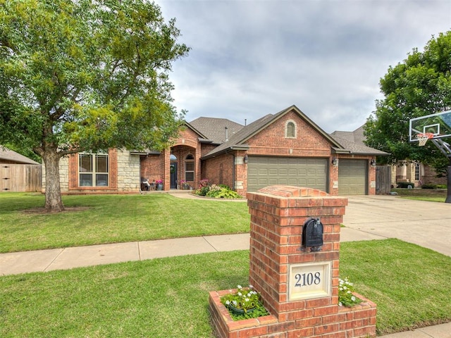 2108 Mulberry Creek Ave, Yukon, OK 73099 - view of front of house with an attached garage, brick siding, concrete driveway, and a shingled roof