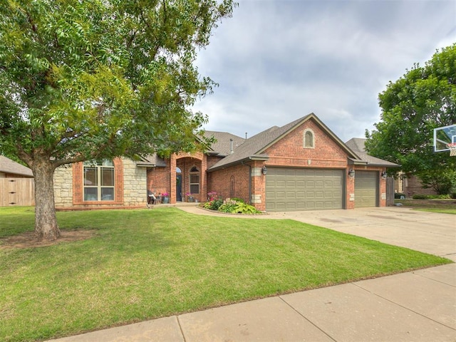 2108 Mulberry Creek Ave, Yukon, OK 73099 - view of front of house featuring a garage, brick siding, a front lawn, and driveway