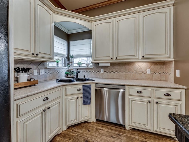 2108 Mulberry Creek Ave, Yukon, OK 73099 - kitchen featuring dishwasher, cream cabinetry, wood finished floors, and decorative backsplash