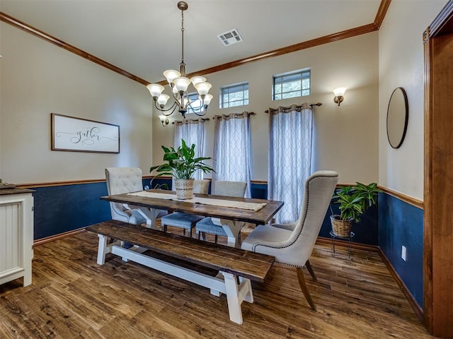 2108 Mulberry Creek Ave, Yukon, OK 73099 - dining space with a chandelier, ornamental molding, and wood finished floors