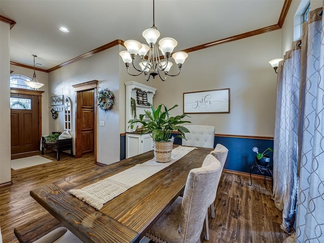 2108 Mulberry Creek Ave, Yukon, OK 73099 - dining room featuring wood finished floors, ornamental molding, a chandelier, and recessed lighting