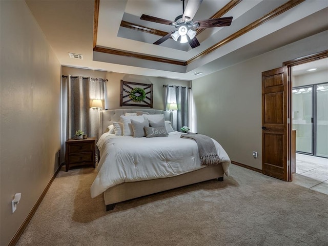 2108 Mulberry Creek Ave, Yukon, OK 73099 - bedroom with light colored carpet, a tray ceiling, ensuite bathroom, a ceiling fan, and crown molding