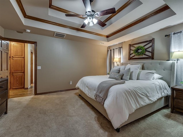 2108 Mulberry Creek Ave, Yukon, OK 73099 - bedroom with a raised ceiling, ornamental molding, light carpet, and a ceiling fan