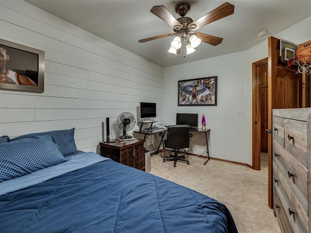 2108 Mulberry Creek Ave, Yukon, OK 73099 - carpeted bedroom with an office area, wood walls, and a ceiling fan