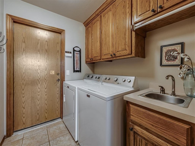 2108 Mulberry Creek Ave, Yukon, OK 73099 - laundry room with washer and dryer, cabinet space, and light tile patterned floors
