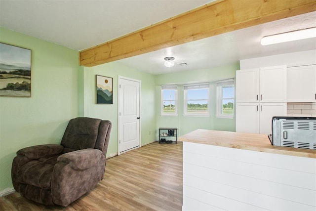 870 S Cemetery Rd Unit 2940, Tuttle, OK 73089 - sitting room with light wood-type flooring and beam ceiling