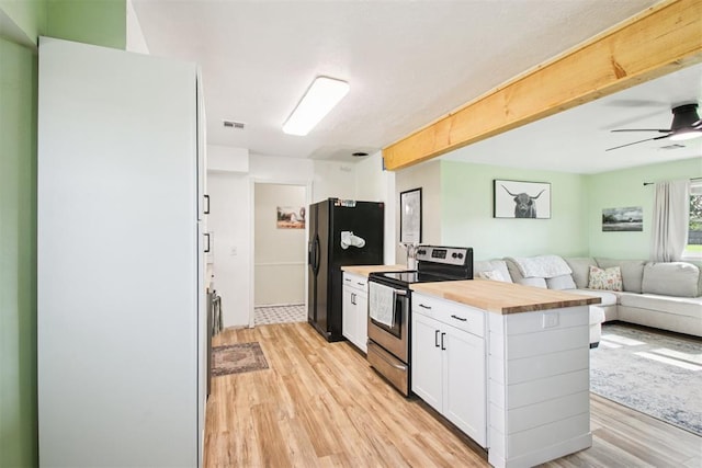 870 S Cemetery Rd Unit 2940, Tuttle, OK 73089 - kitchen featuring stainless steel electric range, open floor plan, light wood-style floors, and butcher block countertops