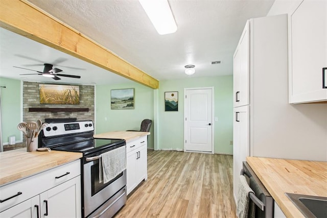 870 S Cemetery Rd Unit 2940, Tuttle, OK 73089 - kitchen with appliances with stainless steel finishes, wooden counters, light wood-type flooring, and white cabinets