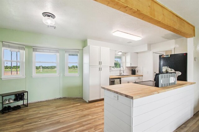 870 S Cemetery Rd Unit 2940, Tuttle, OK 73089 - kitchen featuring wood counters, refrigerator, light wood finished floors, white cabinetry, and healthy amount of natural light