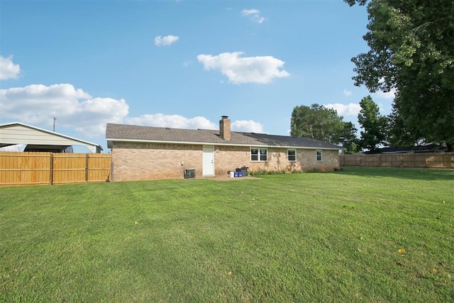 870 S Cemetery Rd Unit 2940, Tuttle, OK 73089 - back of house featuring a fenced backyard, a chimney, and brick siding