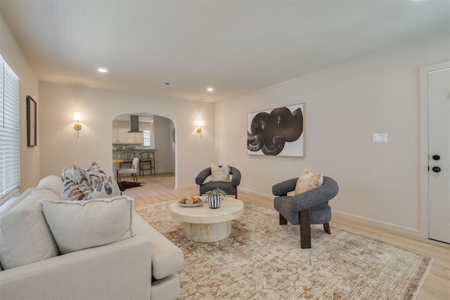 1109 NE 17th St, Oklahoma City, OK 73111 - living room with arched walkways, light wood-style flooring, and recessed lighting
