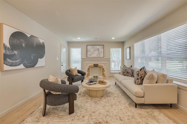 1109 NE 17th St, Oklahoma City, OK 73111 - living room featuring light wood finished floors, a fireplace, and recessed lighting
